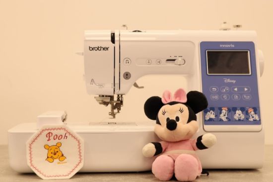 Brother innovis M380D Compact sewing and embroidery machine featuring disney designs